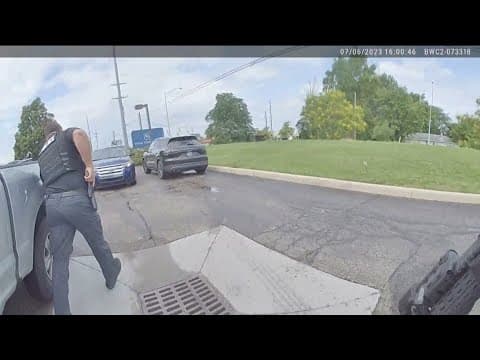 Bodycam video shows officers responding to bank robbery before pursuit