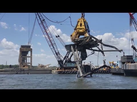 Crews get ready to fully reopen the main shipping channel to the Port of Baltimore