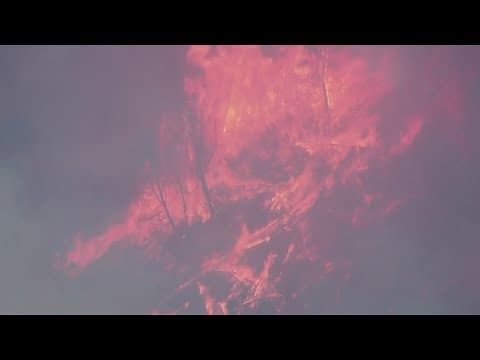 Large wildfires continue to burn in about a dozen states