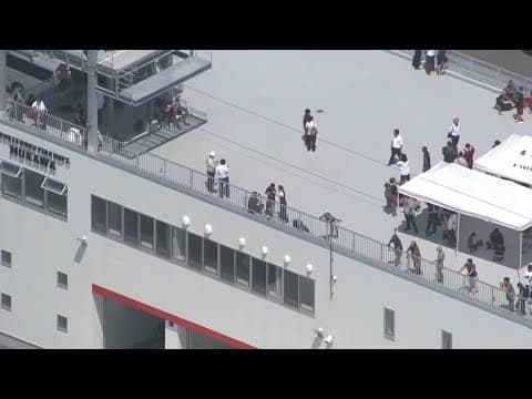 Raw video: People in Japan went to building's roof as they prepared for possible tsunami